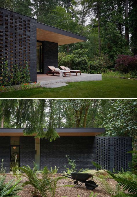 A Black Brick Exterior Is Consistent With The Dark Forest Surrounding This Modern Home Black Brick Architecture, Black Brick House Exterior Modern, Dark Brick Exterior, Dark Brick House, Black Stone House, Dark Brick House Exterior, Black Brick Exterior, Black Brick House Exterior, Modern Black Houses