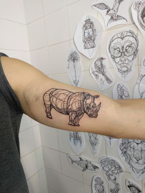 Rhinoceros linework by Nouvelle Rita at Big Boys Tattoo in Lisbon Portugal Rhino Tattoos, Boys Tattoo, Rhino Tattoo, Tattoo Website, Hunter Tattoo, R Tattoo, Important Life Lessons, Boy Tattoos, White Tattoo