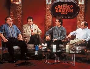 19. "The Merv Griffin Show" (1997) Kramer rescues the Merv Griffin set from the trash and sets up a talk show in his apartment.  Elaine attempts to "out sidle" a new employee at the office.  George's girlfriend is mad because he keeps running over small animals.  Meanwhile everyone goes to Jerry's girlfriends apartment to play with her toy collection. Merv Griffin Show, Seinfeld Episodes, Barney Miller, Merv Griffin, King Of Queens, Classic Comedies, Seinfeld, Catch Phrase, Me Tv