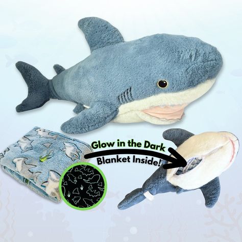 Meet Finn -- the Shark stuffed animal with a detachable glow-in-the-dark shark blanket that velcros and stores inside!  Finn the Shark is a uniquely charming plush toy featuring a delightful surprise--a 60" x 40" glow-in-the-dark shark-themed blanket tucked inside. Crafted with the softest materials, Finn promises a cozy embrace for little ones, offering a comforting companion for both playtime adventures and peaceful nights of sleep. The hand-designed blanket even detaches via velcro for easy machine wash. Expose the blanket to sunlight or bright light for 15-30 minutes to bring the glowing sharks to life! Sizing: 29" Plush with 60" x 40" Blanket Blanket Buddies is a US veteran-owned small business.  Thank you for choosing a Blanket Buddies product! Sea Creatures Plushies, Stuffed Sea Animals, Shark Build A Bear, Ocean Animal Plushies, Shark Plushies, Shark Gift Ideas, Shark Themed Bedroom, Shark Toys, Shark Stuffed Animal