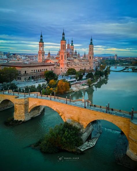 ᴅᴀɴɪ | ᴛʀᴀᴠᴇʟ | ʟᴀɴᴅsᴄᴀᴘᴇs & ᴄɪᴛɪᴇs on Instagram: "📍 The Puente de Piedra (English: Stone Bridge) is a bridge across the river Ebro in Zaragoza, Spain. The Puente de Piedra is also called the Bridge of Lions because since 1991 four lions (symbols of the city) have been placed on the pillars at each end of the bridge. The lion statues were designed by Francisco Rallo Lahoz. ⛪️ The Basilica of Our Lady of the Pillar in Zaragoza is considered both one of the top Cathedrals as well as one of the mo Our Lady Of The Pillar, Zaragoza Spain, Bridge Painting, Stone Bridge, Minecraft Projects, Beautiful Photos Of Nature, Aragon, A Bridge, The Lion