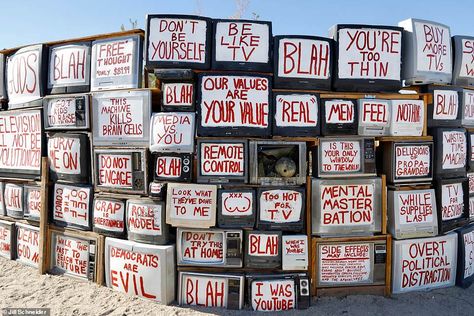 A TV wall with writings on the front is seen in this photo taken in Slab City Slab City, Salvation Mountain, Salton Sea, Wall Writing, Roadside Attractions, Witch House, Military Base, California Dreaming, Old Tv