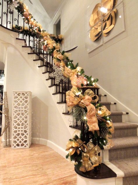 Entry garland on handrail. Gold ribbon on pre lit garland with snowflakes and ornaments among the pinecones. Designed by Natalie Warchola of Warchola’s Holiday Designs LLC. Stairs Garland, Stairway Decor Ideas, Christmas Stairway, Stairway Decor, Christmas Stairs, Stairway Decorating, Pre Lit Garland, Christmas Staircase, Christmas Entryway