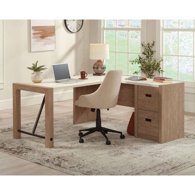 This L-shaped office desk from the Dixon City collection is a little bit country, with a touch of contemporary, high-end style. The base of this commercial office desk is finished in the rustic, natural tones of Brushed Oak with a Pebble White accent finish on the desk surface for contrast that provides an elegant glow. This L-shaped desk with drawers has a powder coated metal support frame for a touch of rustic flair. Strong and lightweight panel construction gives a unique look and provides ea Luxury L Shaped Desk, T Shape Desk Office, Home Office Executive Desk, Office Files Organization Ideas, L-shaped Desk, Office With Corner Desk, L Shape Desk Office Layout Small Spaces, L Shaped Desk Office Layout, Havenly Office