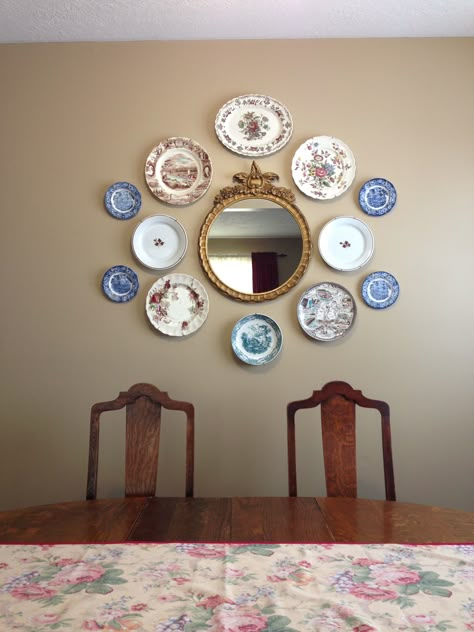 Plates and mirror on dining room wall. Paint is Benjamin Moore Lennox Tan Plates And Mirror On Wall, Antique Plates On Wall Kitchens, Gallery Wall With Plates, Wall Mirror Ideas Dining Room, Blue Plates On Wall, Antique Plates On Wall, Room Wall Mirror Ideas, Dining Room Wall Mirror, Mirror Wall Ideas