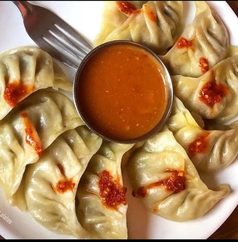 dumpling, small mass of leavened dough that is either boiled or steamed and served in soups or stews or with fruit. Dumplings are most commonly formed from flour or meal bound with egg and then simmered in water or gravy stock until they take on a light cakey texture. Steamed Soup Dumplings, Fruit Dumplings, Dumplings, In Water, Gravy, Stew, Soups, Flour, Dough