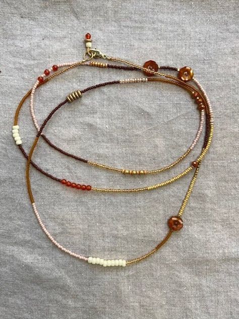 Beautiful, one of a kind, extra long, single-strand wrap beaded necklace. Handmade with an artfully chosen, unique mix of oranges and pinks: carnelian, Czech glass, and seed beads, with gold-plated findings. Can be worn many different ways; single, double, or triple wrapped, and even as a multi wrap bracelet. You can spin it around to highlight different stones or colors.  Great worn alone, but also super fun when layered with more necklaces; either another one from our collection, or your own t Boho Beads Necklace, Long Seed Bead Necklace, Beading Necklace, Jewelry Shop Display, Mixed Beads Necklace, Multi Wrap Bracelet, Natural Boho, Wrap Necklace, Beaded Jewelry Designs