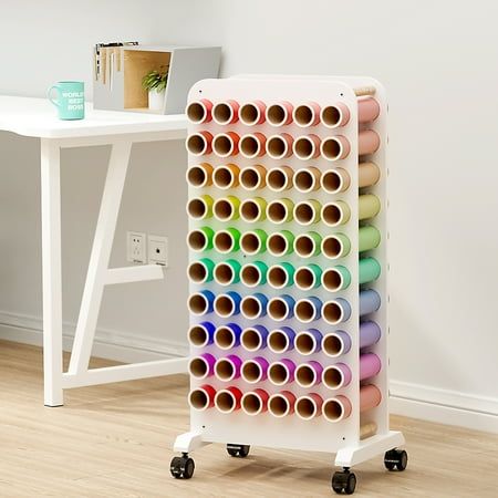 How much time do you spend searching for the vinyl you want among piles of them? This rolling vinyl roll storage rack makes everything clear and within reach! Four swivel wheels, two have brakes, give you the edge in portability and accessibility. You can take your creativity from the craft room to anywhere inspiration strikes. Let us turn your ideas into reality Color: White. Vinyl Organizer, Vinyl Roll Holder, Craft Storage Cart, Gift Wrap Organization, Vinyl Roll, Machines Fabric, Sewing Furniture, Storage Table, Vinyl Storage