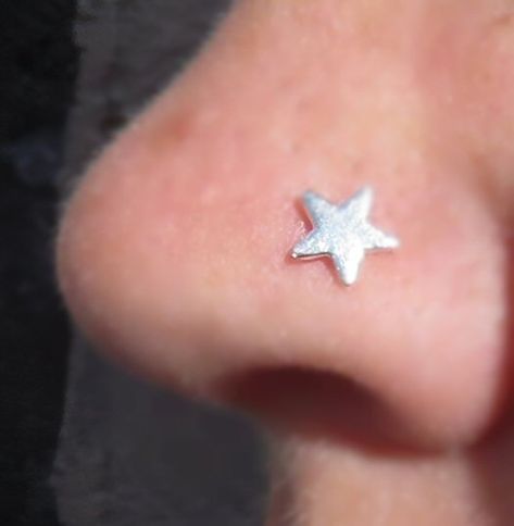 These sweet little studs have a fine silver star on a sterling silver post,  The largest star measures approximately 5mm across, the smallest is approximately 2mm. Its post is 0.80mm diameter.  They come with a hook or coil, please choose from drop down menu.   The hook is bent to a right angle in the middle of the 9.5mm post to fit in your nose, but if you would like it straight to bend yourself just choose that option.  The coil can be bought for a left or right nostril .  We also do moons, fo Star Stud Nose Piercing, Cool Nose Studs, Star Nostril Piercing, Cool Nose Piercings, Nose Pericings, Star Nose Piercing, Star Nose Ring, Nose Piercing Nostril, Star Nose Stud