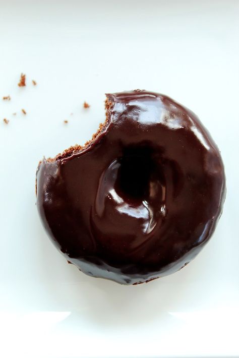 Donuts aren’t just for breakfast anymore.  Especially when you have a rich chocolate donut covered in a chocolate glaze.  These baked donuts are like miniature desserts that are super moist, packed with chocolate flavor and finished off with a shiny chocolate frosting.  Perfect with coffee, tea, milk, soda, beer, wine, margaritas … ok, maybe not margaritas.  Recipe on butterandbliss.net. Spanish Hot Chocolate, Miniature Desserts, Brownie Vegan, Donut Baking Pan, Easy Donut Recipe, Making Donuts, Chocolate Glazed Donuts, Chocolate Donut, Homemade Donuts