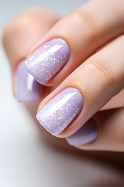 lavender nails, pastel nails, lavender nail design, pastel nail ideas, beautiful nails, trendy nail colors, nail inspiration, nail art, nail trends, nail goals, nail aesthetics, chic nails, feminine nails, nail inspo, nail vibes, nail styles, nail beauty, lavender manicure, pretty nail designs, lavender beauty, nail perfection, pastel hues, nail creativity, stunning nails, lavender elegance Lavender And Glitter Nails, Lavender Nails For Wedding, Lavender Sparkle Nails, Lavender Wedding Nails, Nail Art Lavender, Nail Designs Lavender, Lilac Nails With Glitter, Lavender Nail Design, Lavender Manicure