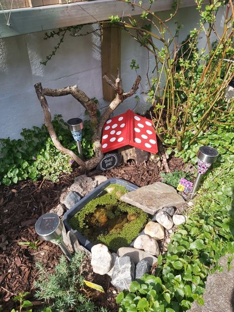 We've created this toad abode for a toad that we're being given to keep the slugs and snails under control in my small garden! 
My partner hollowed out a tree stump and put a roof on top using reclaimed timber. Most of the log is buried and I've added wood mulch and loose earth to burrow in, inside. We created a pond with a washing up bowl, it has rocks inside and surrounding so a toad can get in and out (all washed off water before use) and I've added rain water and oxygenating pond weed. :) Toad Abode, Small Water Gardens, Toad House, Habitat Garden, Garden Frogs, Faeries Gardens, Wildlife Gardening, Backyard Diy Projects, Diy Garden Projects