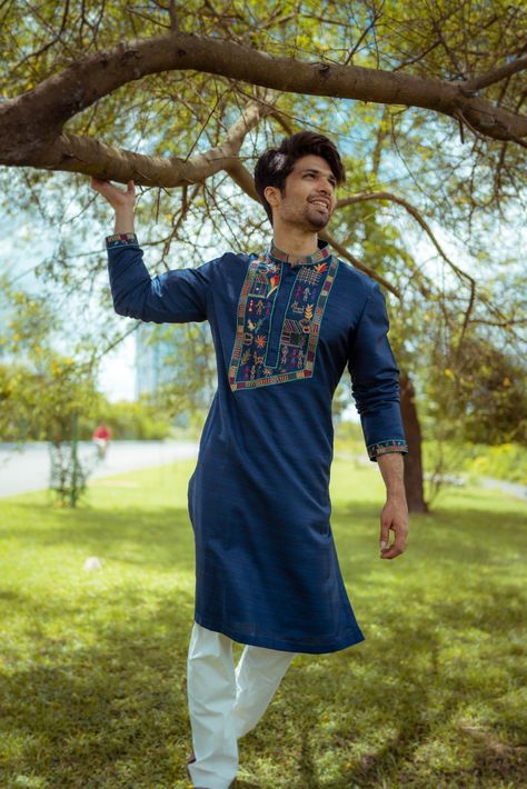 Rich blue kurta with intricate Warli folk art on silk fabric. The miniature artform depicts beauty of India's rural livelihood. Teamed up with white pajama. Now available in store. Appointments@ 7044393333 (WhatsApp/Call) Address: 38, CB Block, Sector 1, Salt Lake, Kolkata - 700064 https://maps.app.goo.gl/bC2n8q1LXh9GWQdr7 Panjabi Design For Men Fabric, Navratri Kurti, Eid Kurta, India Fashion Men, Pathani Suit, Stylish Boy Clothes, Embroidery Kurta, Wedding Kurta, Wedding Kurta For Men