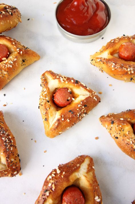 Pretzel Bagel Dog Hamantaschen Recipe | The Nosher Purim Seudah Ideas, Hamentashen Filling, Pretzel Bagel, Hamentashen Recipe, Purim Recipe, Purim Ideas, Hamantaschen Recipe, Purim Party, Chag Sameach