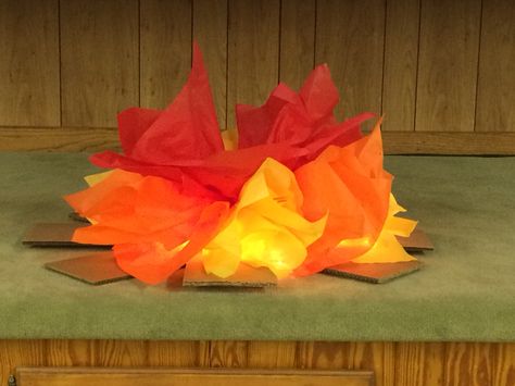 Fake fire for VBS. I used tissue paper and wedding lights for the glow. #vbs #abackyardadventure Fake Campfire, Tree Trunk Slices, Fake Fire, Paper Fire, Indoor Camping, Camping Decor, Camping Party, Indoor Fun, Camping Theme