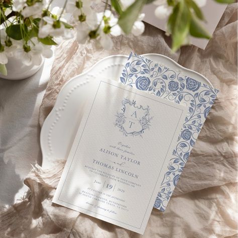 Formal & elegant crest monogram dusty blue wedding invitation with delicate rose flower pattern on the back. Wedding Invitation With Monogram, Dusty Blue Wedding Details, Wedding Invitations Blue And White, Blue Willow Wedding, Light Blue Wedding Invitations, Wedding Crest Monogram, Wedding Invitation Blue, Save The Date Floral, Classic Blue Wedding