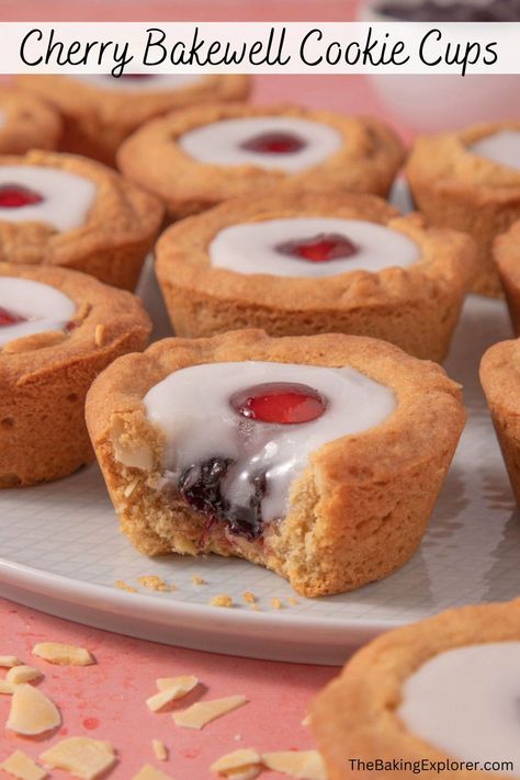 Recipe for Cherry Bakewell Cookie Cups - brown sugar and almonds cookie cups filled with cherry jam, icing and a glace cherry. Yummy & retro! #thebakingexplorer #cookiecups #cherrybakewell #almond #retrobaking Cherry Bakewell Cupcakes, Almond Icing, Cherry Topping, Cherry Bakewell, Cherry Jam, Gooey Cookies, Bakewell Tart, Glace Cherries, Soft Sugar