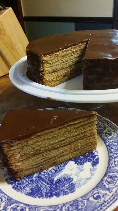 Baumkuchen All ingredients should be room temperature Cake: 1 1/2 cups almond paste, tightly packed (12 oz) 6 Tbsp half & half 1 1/2 sticks butter, softened 1 cup sugar 10 eggs, separated 1 1/2 tsp vanilla extract 1 cup cake flour 3/4 cup cornstarch ½ teaspoon salt 10 oz jar plum or apricot jam 2 tablespoons butter, melted for pan Chocolate Glaze: 6 Tbsp butter 2 Tbsp rum 1 Tbsp vanilla extract 3 Tbsp light corn syrup 6 oz semi-sweet chocolate chips In the bowl of a standing mixer fitted with th Grandma Chocolate Cake, Seven Layer Chocolate Cake, 16 Layer Chocolate Cake, 15 Layer Chocolate Cake Recipe, Cooked Chocolate Icing Old Fashioned, Boiled Chocolate Icing Old Fashioned, 7 Layer Chocolate Cake, Boiled Chocolate Icing, 12 Layer Chocolate Cake Recipe