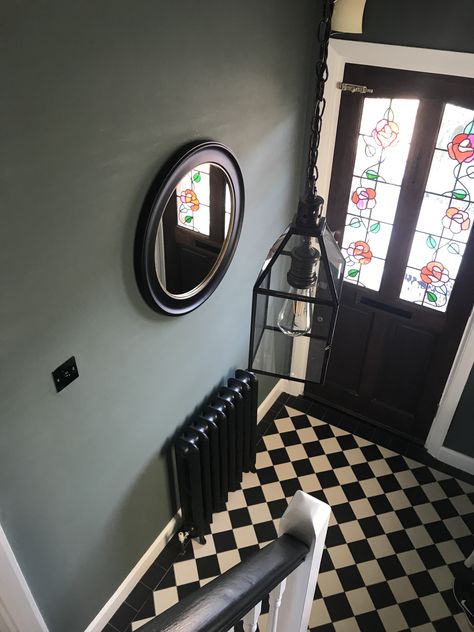 An important room in the house, make it count..painted using farrow & Ball Green Smoke Black And Green Hallway, Green Hall Stairs And Landing Decor, Dark Victorian Hallway, Hallway Dark Bannister, Green Hallways, Edwardian Tiled Hallway, Black Hallway Radiator, Green Hallway Ideas, Black And White Victorian Tiles Hallway