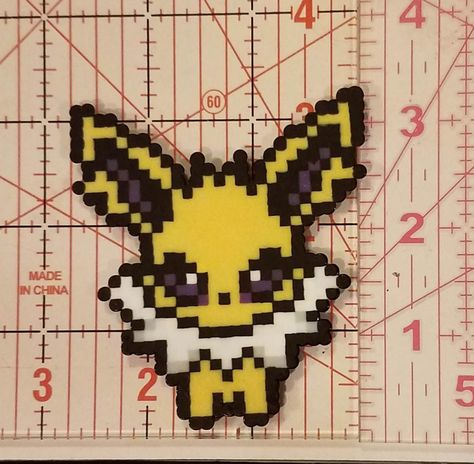 Jolteon pokemon made out of perler beads. Perler Beads Pokemon, Pokemon Jolteon, Bead Things, Pokemon Bead, Perler Creations, Pixel Art Grid, Pixel Pattern, Bead Ideas, Perler Bead Art