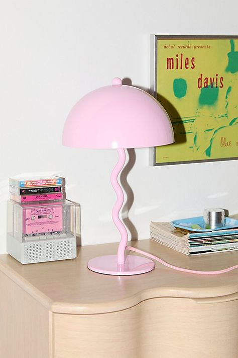 Refresh your lighting with this groovy table lamp. Crafted from iron with an oversized dome-shaped shade, this table lamp features a wiggly base for a playfully modern look we love. Plugs in to power on. Available exclusively at Urban Outfitters. Features Statement table lamp from our Alora lighting collection Oversized dome-shaped shade Wiggling base made from tubular iron Plug in Requires two E12 Type C 7W bulbs - not included Assembly required UO exclusive Content + Care Assembly required - a Desk Setup Colorful, Unique Lamp, 90s Inspired Room, Groovy Room, Bright Furniture, Pink Lamp, Pink Desk, Urban Decor, Uo Home