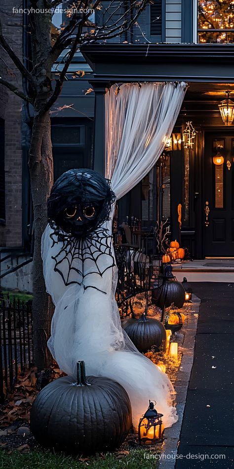 The use of black lace curtains and flickering candles brings a stylish Halloween transformation to your yard, making it both haunting and elegant. Halloween Pergola Decor, Halloween Shed Decor, Halloween Gazebo, Halloween Yard Displays Diy, Rooftop Halloween Decorations, Halloween Gauze Front Porch, Elegant Halloween Decor Outdoor, Halloween Rooftop Decorations, Classy Halloween Decor Outdoor