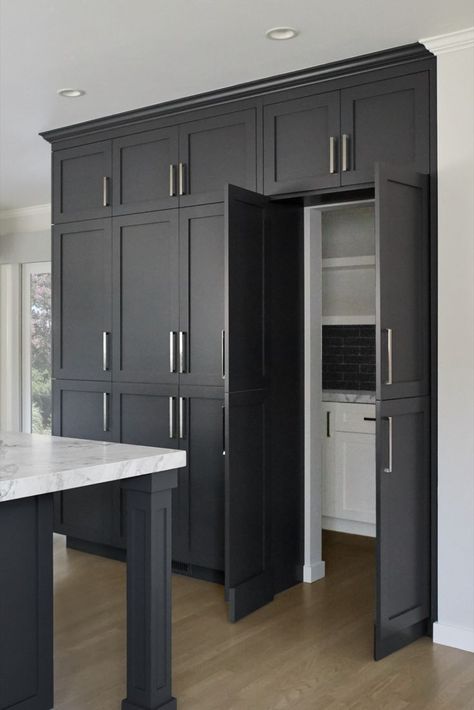 kitchen remodel with tall dark cabinets hidden pantry inside Kitchen With Secret Pantry, Secret Kitchen Pantry, Pull Up Kitchen Cabinet Doors, Walk In Pantry Behind Kitchen Wall, Hidden Utility Room In Kitchen, Cabinet Wall Kitchen, Cool Home Features, Hidden Kitchen Pantry, Hidden Pantry Walk In