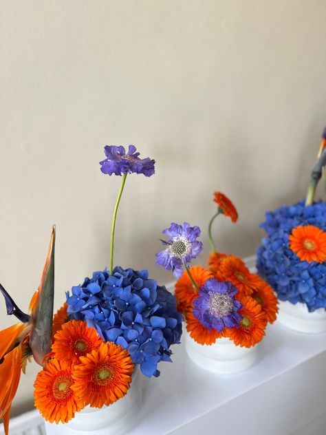 Blue & orange event flowers Blue Tea Party, Sprinkle Decor, Orange And Blue Flowers, Event Florals, Blue Floral Wedding, Baby Favors, Blue Tea, Everlasting Flowers, Light Blue Flowers