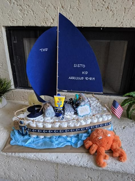 Sailboat Baby Shower Theme, Diaper Cake Fishing Theme, Diy Sailboat, Boat Diaper Cake, Diaper Centerpiece, Cake For Baby Shower, Motorcycle Diaper Cake, Nautica Theme Baby Shower, Ahoy It’s A Boy Baby Shower Decorations