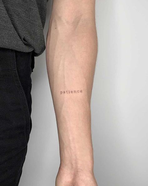 A tiny word ‘patience’ inked on the left forearm by Conz Thomas Patience Tattoos, Patience Tattoo Ideas, Word Tattoo Placements, Patience Tattoo, Tattoo Font For Men, Tatuagem Masculina Pequena, Tattoo Dotwork, Small Forearm Tattoos, Arm Band Tattoo