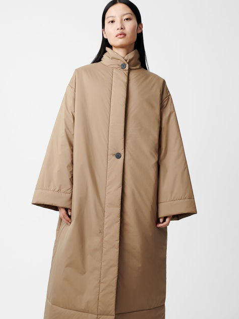 The oversized, cocooning silhouette of the Pallan is a play on our best-selling Kariba. Its clean exterior is achieved through a hidden placket and short collar, while its voluminous fit is perfect for layering. It's cut from a powder-coated parachute nylon, and filled with Ecodown fibres for superior heat retention. Studio Nicholson, Padded Coat, Down Coat, Outerwear Women, Stand Collar, Powder Coated, What To Wear, Pinterest Likes, Couture