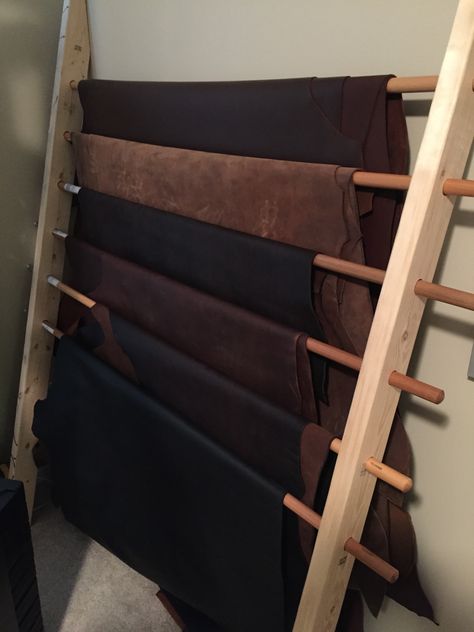 Sturdy Leather Wrack: 2x4s and replacement broom handles Leather Craft Studio, Leather Store Design, Leather Workshop Ideas Design, Leather Hide Storage Ideas, Leather Working Station, Leather Storage Ideas, Leather Workshop Studio, Leather Workshop Ideas, Leather Studio