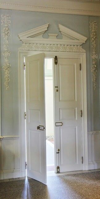 Pale blue walls with Rococo ornamentation and a broken pediment above door. Bridgerton Romance, Interior Doorway, Georgian Fireplace, Door Canopies, Dog Ate My Homework, Bed Crown, Blue Doors, Georgian Interiors, Victorian Door