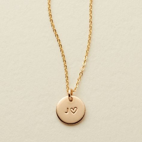 The Amore Disc is a meaningful and beautiful way to carry a loved one with you wherever you may go. Always remember them whether they are near or far with their initial hand stamped alongside our hand-drawn heart on our 3/8" disc. Semicolon Symbol, Mary Jewelry, Gold Bar Necklace Personalized, Hamsa Necklace Gold, Dainty Necklace Layered, Made By Mary, Gold Disc Necklace, Dainty Choker, Hamsa Necklace