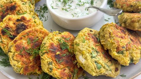 Made with chickpea flour, potatoes, and split peas, these crispy yet pillowy fritters are vegan, gluten-free, and full of fresh spring flavor. Pea Patties, Lemon Dill Sauce, Split Peas, Potato Patties, Patties Recipe, Split Pea, Chickpea Flour, Sliced Tomato, Tasting Table