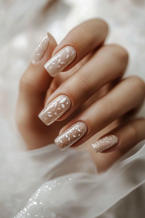 Hand with elegantly manicured nails featuring intricate white floral designs and glitter. Basic Valentines Nails, Valentines Nails Almond Shape, Nails Acrylic Korean, Short Nail Designs Valentines, Valentines Day Nails Square, Korean Nails Short, Valentines Nails Red, Red Valentines Nails, Ivory Nails