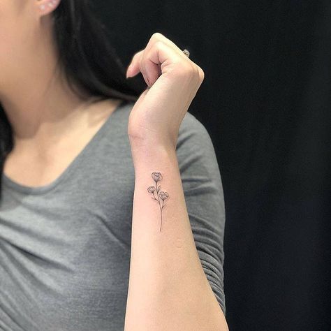 Flower On Side Of Wrist, Tiny Sweet Pea Tattoo, 3 Small Flowers Tattoo, April Sweet Pea Tattoo, Wrist Tattoos For Women Flower, Tattoo Outer Wrist, Tattoo Flower Wrist, Small Forearm Tattoos For Women, Pretty Wrist Tattoos For Women