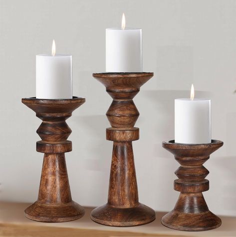 PRICES MAY VARY. High quality solid Mango wood construction. Perfect for 2.5-3 inch diameter candle. Featuring graceful designs of traditional farmhouse elegance, this set of 3 handmade wooden candle pillarrs will showcase your pillar and votive wax or LED candles. Complete your home decor by adding vintage style candle holder set as your table centerpiece or to your fireplace mantle, nightstand, or shelf. Perfect for everyday use, wedding, events, aromatherapy, Spa, Reiki, Meditation. Intricate Uncle Vanya, Wooden Pillar Candle Holders, Wood Pillar Candle Holders, Farmhouse Candle Holders, Farmhouse Candle, Wooden Pillars, Wood Candle Holder, Farmhouse Candles, Tall Candle Holders