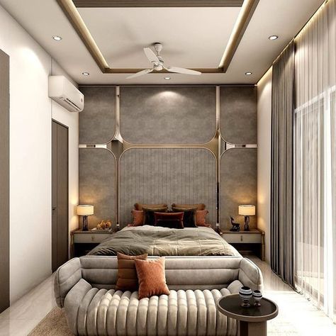 This Super Stylist bedroom with 🛏 Bed has Cushioned Couch with a ☕ Coffee Table. Bed Backwall Divided in Grid Pattern with Mirror. 📺 T.V. Unit on the Opposite Wall is Finish with Grey Laminate. Shelves on the Both Side of the T.V. is Displaying the Artifacts. Geometrical Design in Gold Colour is adding the Pattern to the Space - GharPedia Side Table With Drawers, Grey And Gold Bedroom, Mirror Side Table, Holiday Bedroom, Sitting Room Design, Grey Laminate, Living Room Tv Unit Designs, Geometrical Design, Table With Drawers