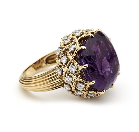 Mounted with a large amethyst in a gold rope twist gallery hung with brilliant cut diamonds, to reeded gold shank Cartier, Paris, Signed, Hallmarked and Numbered Amethyst 18mm cross Rings Purple, Cartier Accessories, Amethyst Rings, Amethyst And Diamond Ring, Purple Jewelry, Discount Jewelry, Diamond Cocktail Rings, Amethyst Jewelry, Cheap Jewelry