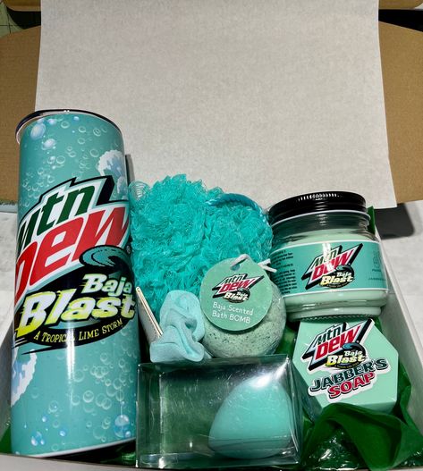 This is a Mountain Dew Baja Blast Themed Mother's Day Bath Gift set *  * 20 Oz Tumbler with Metal Straw  * Handmade Baja Blast Scented Bath Bomb  * Handmade Baja Blast Scented Candle  * Baja Color Make Up sponge  * Baja Color Hair Scrunchie  * Handmade Baja Blast Scented Triple Butter Bar of Soap.  * Perfect gift idea for Your Mother Figure in your life who loves Baja Blast.. Mountain Dew Gifts, Baha Blast, Mtn Dew Baja Blast, Mountain Dew Baja Blast, Baja Blast, Make Up Sponge, Mtn Dew, Monster Crafts, Nostalgic Candy