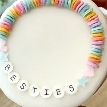 Jenny on Instagram: "💕friendship bracelet cookie! With a 3d printed stencil, the “beads” were thick enough to make them look more like the real beads so it worked out really well! ♡ Someone requested a stencil for semi circles so they could make sprinkles to look like little clay beads and I thought it sounded sooo cute so I wanted to test it out on a cookie! I’m obsessed 😍😍 I’ve been loving all the bracelet cookies everyone’s been doing bc I used to make these bracelets so much growing up 😆💓 The STL files for the sprinkle stencils are in my Etsy! I used the Semi circle, star, heart, and circle (the bigger one) for the beads ☺️ #sugarcookies #cookiedecorating #customcookies #sprinkles #stencil #sprinklestencil #baking #valentinesday #cookies" Friendship Bracelet Sugar Cookies, Friendship Bracelet Birthday Cake, Friendship Bracelet Cookies, Friendship Bracelet Cake, Swiftie Cookies, Make Sprinkles, Girls 9th Birthday, 9th Birthday Cake, Taylor Swift Birthday Party Ideas