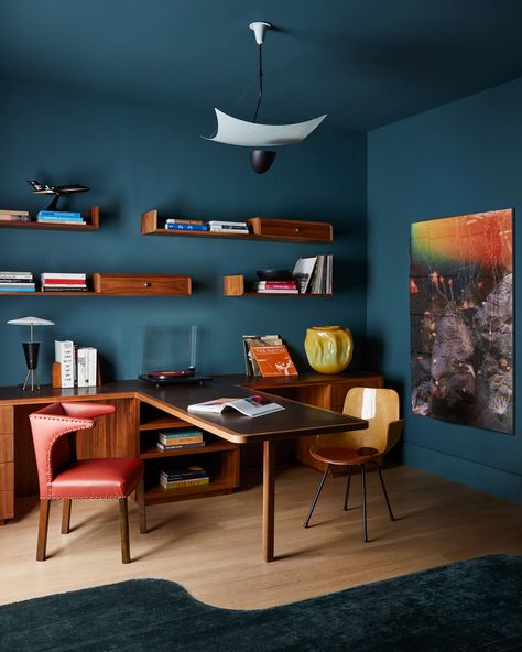 A vintage Model 12385 Vela Ceiling Light by Angelo Lelli suspends above a Medea Armchair by Vittorio Nobili and vintage Frits Henningsen lounge chair in league with a custom Chroma desk tipped in Ashbury leather and Hugh Scott-Douglas’s “Natural History.” Blue And Brown Interior Design, Blue And Brown Interior, Borge Mogensen Chair, San Francisco Home, Pierre Frey Fabric, Vintage Sconces, Linen Headboard, San Francisco Houses, Wenge Wood