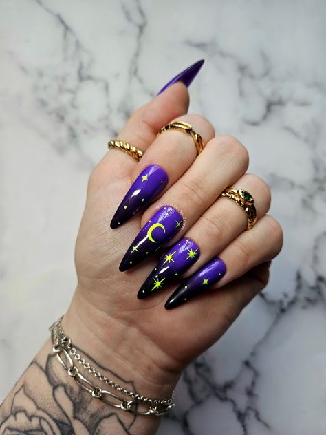 These nails feature a milky white base with a gold chrome celestial pattern. Each nail set includes 10 hand painted, press on nails and a nail prep kit (tube of nail glue, cuticle pusher, nail file/buffer). Lauren is wearing 'long almond' in size Medium. For help with sizing, please use our sizing guide. Dark Purple Halloween Nails, Purple Witchy Nails, Neon Halloween Nails, Purple Halloween Nail Designs, Purple Winter Nails, Painted Nail Designs, Lava Lamp Nails, Nails Celestial, Witch Nail Art