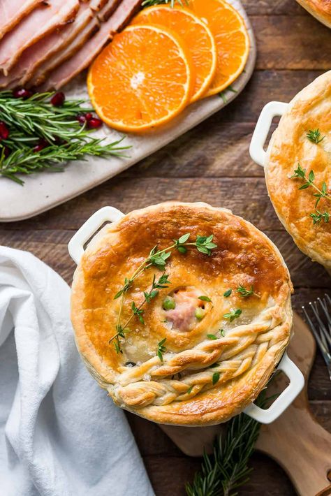 Ham Pot Pie - Leftover ham gets new life in a simple ham pot pie! The creamy filling is full of ham, potatoes, carrots, mushrooms, and peas, and topped with a blanket of puffed pastry. It's a perfect way to reimagine a holiday meal or for a cozy dinner, any time of the year! Turkey And Ham Pot Pie, Leftover Turkey And Ham Pie, Easter Ham Pie Recipe, Ham And Mushroom Pie, Turkey And Ham Pie, Ham Pot Pie, Ham Potatoes, Puffed Pastry, Mushroom Pie