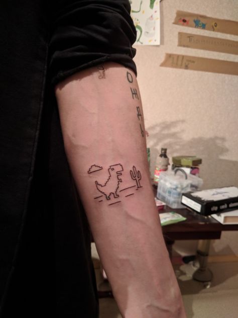 T-Rax. Dino Google Chrome. #tattoo #minimalism #linework #dino #art #pixel #pixelart Chrome Dinosaur Tattoo, Minimal Elements Tattoo, Linework Dinosaur Tattoo, Google Dinosaur Tattoo, Pixelart Tattoos, Pixel Art Tattoo Ideas, Tiny Dino Tattoo, So It Goes Tattoo, Comedy Tattoo