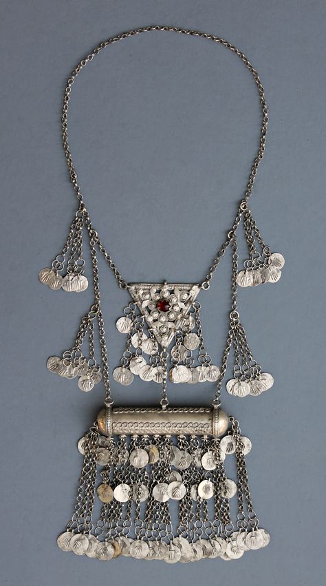 A large amulet holder necklace from rural Turkey. Called a "muskalik" (correted: masura, hamayli) for the amulet box which opens to insert papers. Many dozens of discs imprinted with hands are attached to the necklace. With filigree, appliques, and a glass stone. Probably from Western Turkey from the late 19th century. Central amulet box is 9.5cm x 11cm laid out this way 120 grams Turkey Jewellery Turkish Jewelry, Turkish Jewelry Ottoman, Turkey Jewelry, Afghan Jewelry, Asian Jewelry, Historical Jewellery, Turkish Traditional, Amulet Necklace, Ethnic Necklaces