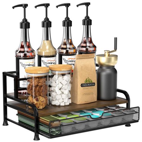 PRICES MAY VARY. [ All-in-One ] Our 3-tier coffee syrup organizer can stand 8 syrup bottles (25.4 oz/750ml) and has a pull-out basket that can store 35 coffee capsules. Stepped design allows for neat placement and easy access to your favorite syrup. Measuring 16" X 9" X 11" with shelves 3.3" and 6" deep. [ Sturdy and Stable ] Our coffee syrup rack is crafted with a sturdy metal frame and solid wood base to ensure stability and load-bearing. Top floor has anti-fall railings to protect bottles. Co Cute Countertop Decor, Cocktail Coffee Bar, Small Coffee Bar On Countertop, Coffee Drawer Organizer, Conference Room Coffee Station, Coffee And Tea Drawer Organization, Coffee Station Accessories, Victorian Coffee Bar, Cowboy Coffee Shop