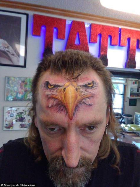 That's certainly eye-catching! This  man got the face of an eagle inked right across his forehead Tattoos