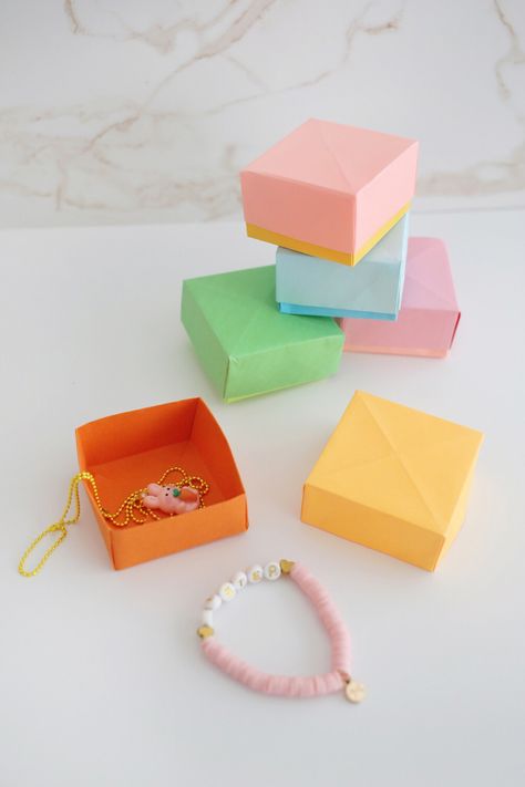 How to Make an Origami Box (with video!) - Childhood Magic Paper Origami, Paper Boxes, Origami Box, Perfect Squares, Small Gift Boxes, Wrapping Ideas, Box With Lid, Instructional Video, Origami Paper